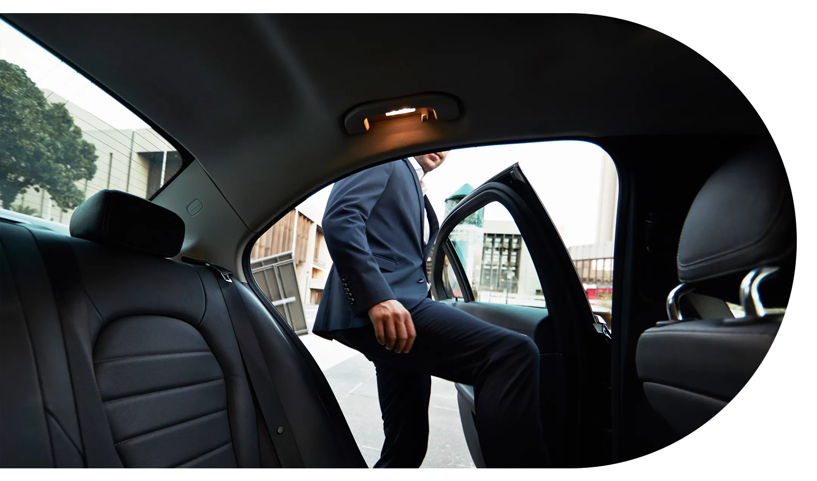 Man looking out an Uber or Lyft window.